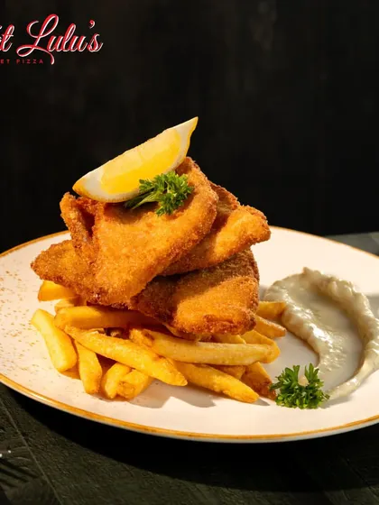 The perfect comfort food for sweater weather. Our crispy Fish and Chips are served hot and fresh with a side of creamy tartar sauce and a lemon wedge.