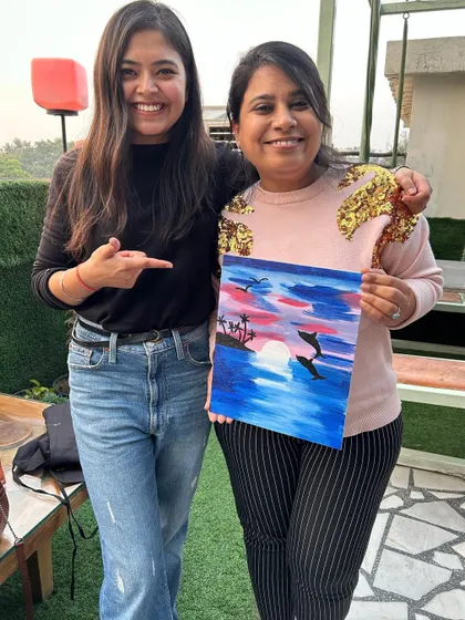 I love seeing participants so proud of their work. This painter did an amazing job with her colors and composition.