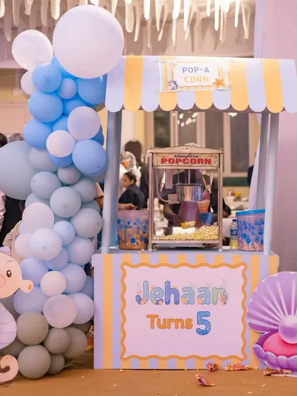 What's a party without snacks? This themed popcorn cart, complete with a custom sign for the birthday boy, was a huge hit with guests of all ages.