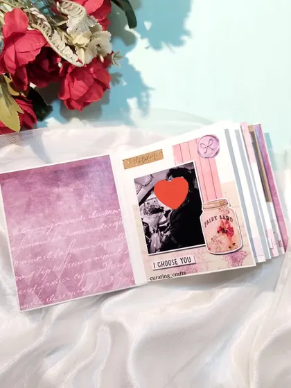 A vintage and love-themed mini scrapbook, perfect for an anniversary.