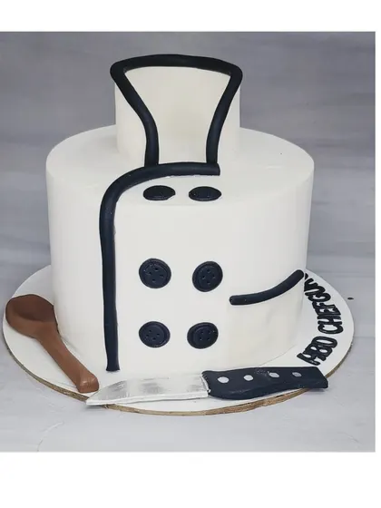A cake designed to look like a chef's uniform. This chocolate truffle indulgence cake is a perfect tribute for a professional chef's birthday.