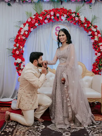 A romantic proposal moment during the engagement ceremony.