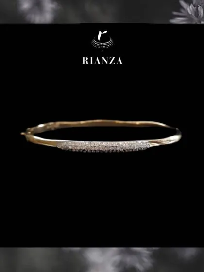 A slightly different angle of the curved daily wear bracelet, showing its delicate sparkle.