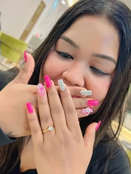 The final look, a perfect manicure for a special occasion. This client is ready to show off her custom 3D nail art.