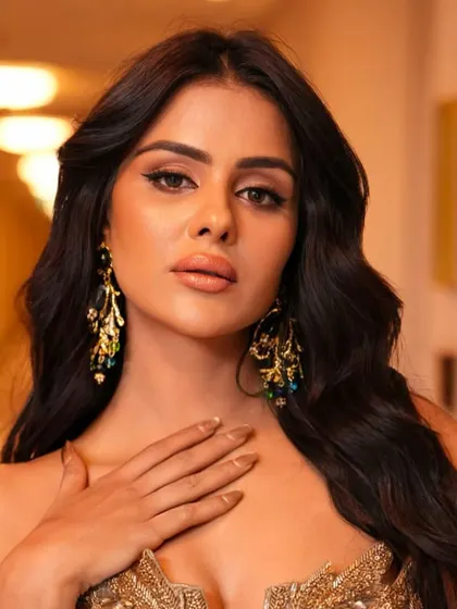A detailed shot of the eye makeup and the stunning statement earrings.