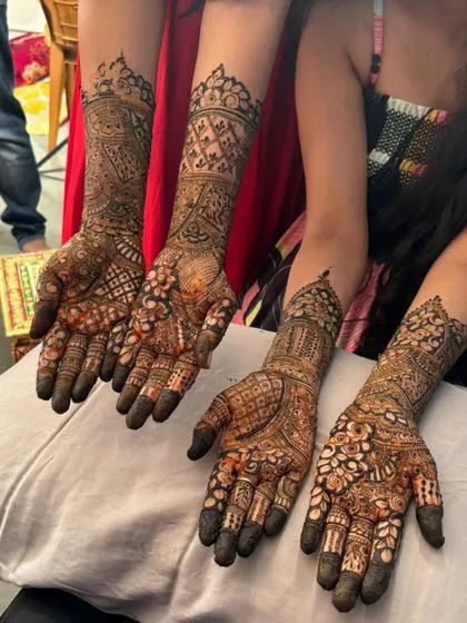 Showcasing multiple full-hand intricate designs for a bridal party.