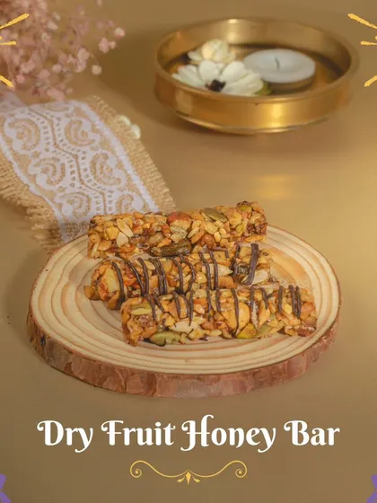 A closer look at the Dry Fruit Honey Bar, drizzled with chocolate. It's a crunchy, nutty, and naturally sweet option for your Diwali celebrations.