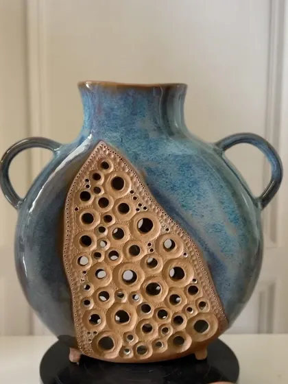 Another angle of the slab-built vase, showing the intricate, hand-pierced details.