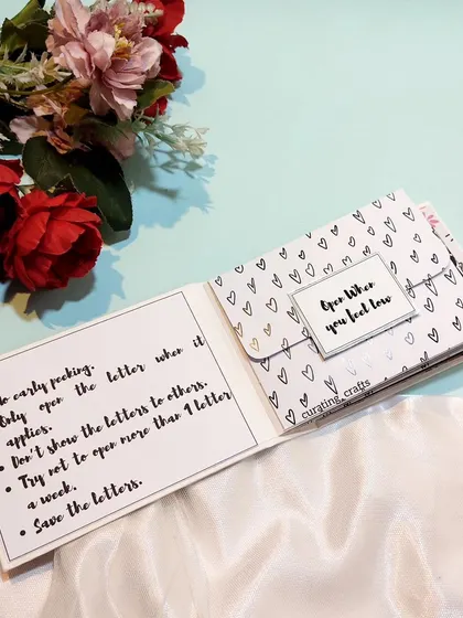 This hamper for a fiancée includes a set of "Open When You Feel..." letters, each containing a heartfelt message for different moods and moments.