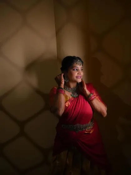 An artistic shot of the client in a different half saree from her wedding festivities, showcasing the versatility of my custom designs.