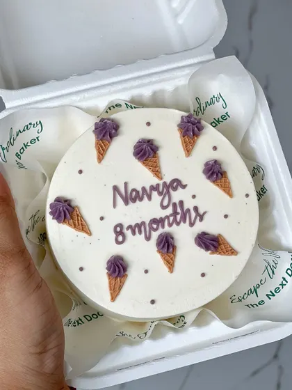 Celebrating monthly milestones is such a sweet idea. This mini cake was for Navya's 8-month celebration, decorated with tiny piped ice cream cones.