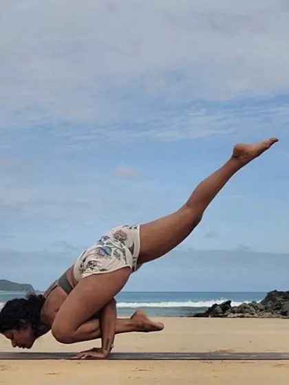 Celebrating Janmashtami with a flying pigeon pose on the beach. This arm balance is a beautiful expression of the inner journey Krishna speaks of, finding our divine nature.