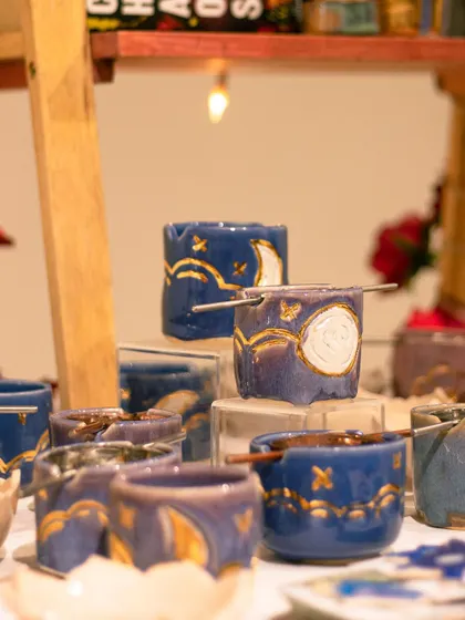 These celestial-themed tea light holders or small cups are adorned with gold luster details, adding a touch of magic. They were a huge hit at our student sale.