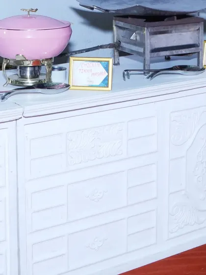 A close-up of our elegant pink chafing dishes on a white counter, ready for service. Even the serving equipment is chosen to complement the event's aesthetic.