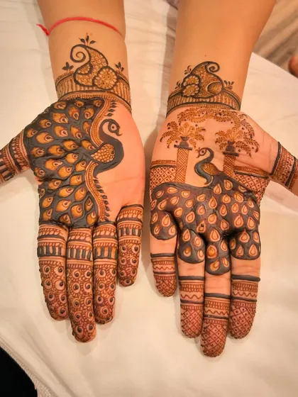 The peacock is a timeless and classic motif in Indian mehndi. In this design, I made it the hero, with bold, flowing feathers covering the entire palm for a dramatic and artistic statement.