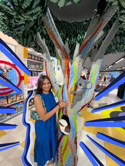 Me and a baby koala at the Lego store in Sydney. The explosive blue doodles make the photo feel more dynamic and fun.