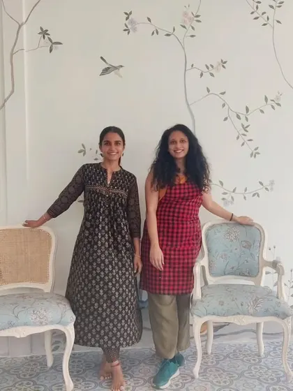 Posing with the host in front of the completed French mural. I love connecting with clients and creating art that they will cherish in their homes.
