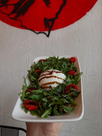 Creamy burrata and fresh greens. Our Burrata salad is just what you need on a warm, sunny day.