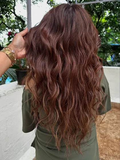 These are 'Ribbon Highlights' styled with waves. The curls make the ribbons of color twist and turn, creating a beautiful, dynamic effect.