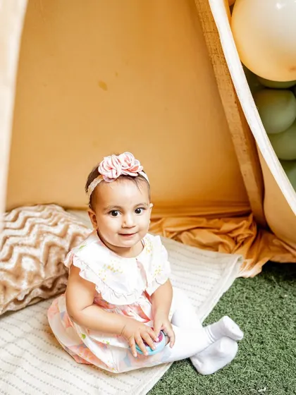 A sweet portrait of the birthday girl in her party tent. These setups make for wonderful photo opportunities during the celebration.