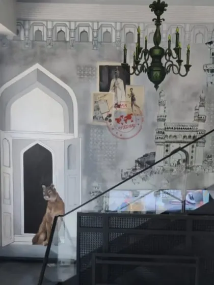 A closer look at the Puma mural, where a realistic puma sits in a classic Indian arched doorway. The piece blends local culture with the global brand, creating a unique and localized art experience for the retail space.