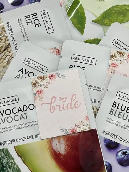 "Team Bride" themed face masks, a fun and practical addition to a bridesmaid pamper hamper.