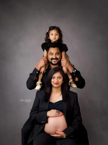 A fun and creative family pose. I love incorporating older siblings into maternity shoots, and this "family totem pole" is a playful way to capture everyone together.