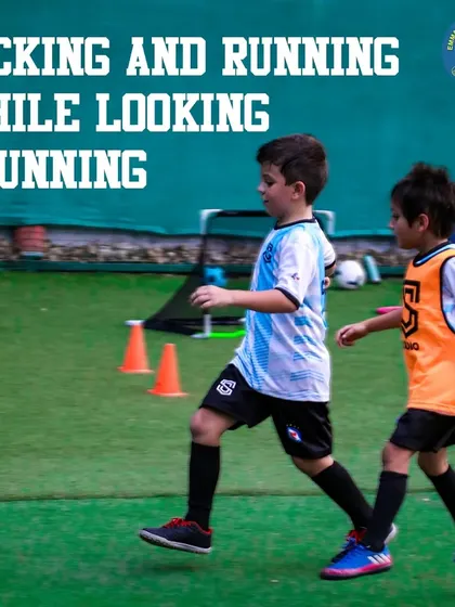 Two young players running drills on the turf. My program is about kicking, running, and developing the determination of a professional footballer.