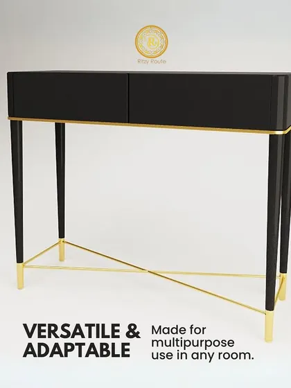 This console table is both versatile and adaptable. The sleek black top and drawers are supported by a slender, gold-finished metal frame, making it a multipurpose piece suitable for an entryway, living room, or bedroom.