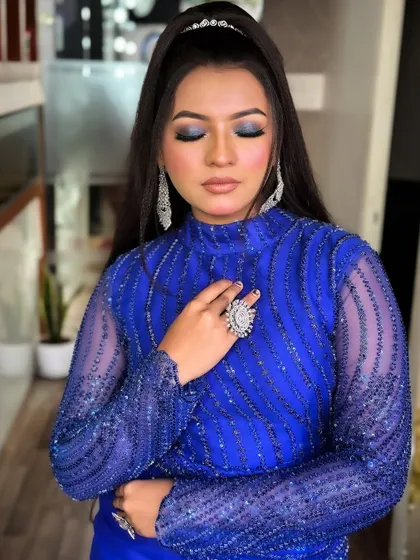 A bold blue smokey eye is the star of this look, demonstrating advanced color and blending techniques.