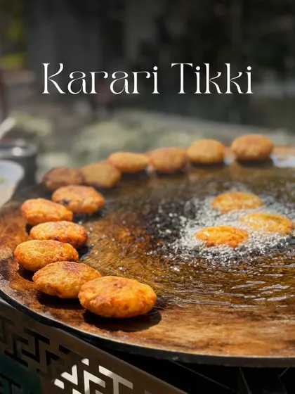 The sizzle of Karari Tikkis on a large tawa is a sight to behold. I fry these potato patties until they are perfectly crisp on the outside and soft on the inside, ready to be topped with chutneys and yogurt.