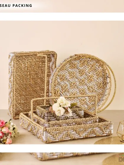 For a cohesive look, I provide matching sets of trousseau packing materials. This collection includes woven baskets and trays in various shapes and sizes, all sharing a beautiful gold and white pattern.