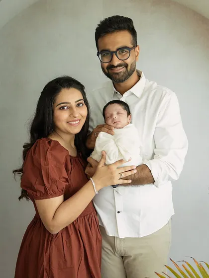 The classic family photo. Everyone looking at the camera, smiling, with their new baby held securely. A must-have shot for every family album.