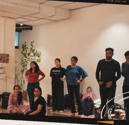 An instructor addresses the class, fostering an environment of open communication and shared learning. We grow together.