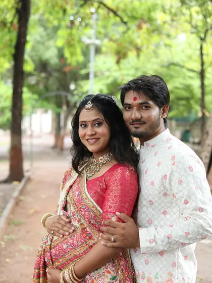 A happy couple portrait from the baby shower. Both are beaming, and her makeup is designed to look fresh and radiant throughout the event.