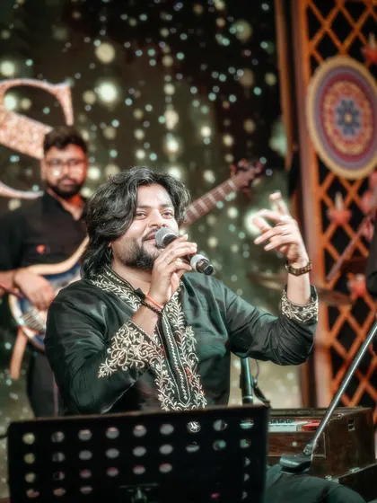 A close-up shot capturing a moment of interaction with my fellow musicians on stage. Our chemistry is key to our seamless performances.