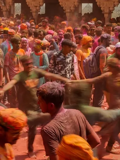 A vibrant collection of images from the Holi celebrations in Braj, specifically Nandgaon. This series captures the pure ecstasy of the festival, with portraits of devotees, men dressed as gopis, and crowds dancing in a cloud of colors.