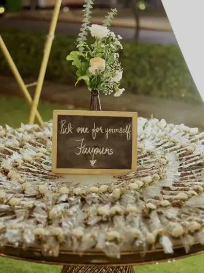 Thoughtful favors for the guests. We arranged these beautifully packaged Mehendi favors on a platter, ready for guests to take home a small piece of the celebration.