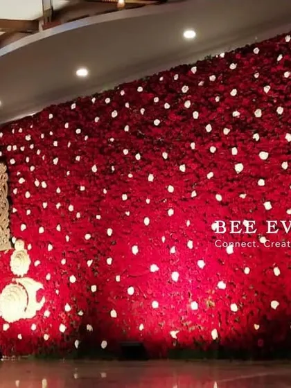 A truly grand statement wall for a reception. We created this entire backdrop using thousands of red roses, with a divine motif of Lord Balaji, blending spiritual reverence with breathtaking floral artistry.