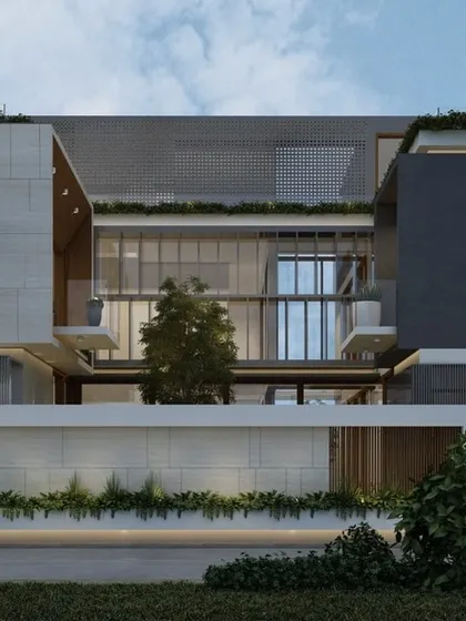 This view reveals the central courtyard that gives the house its name. The design layers solid and transparent surfaces, with perforated screens and glass walls opening the interior to a private green space.