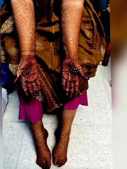 A full view of a bride's hands and feet, showcasing the rich, even stain achieved with my organic henna.