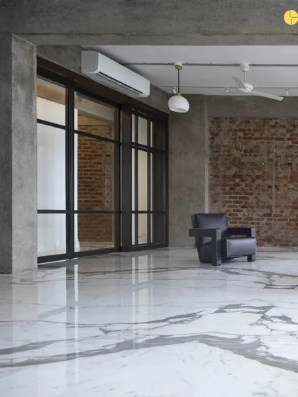 The bare shell of 'The Canvas,' with its marble floors and raw concrete pillars. This initial phase is about understanding the fundamental structure and potential of a space before we begin to shape it.