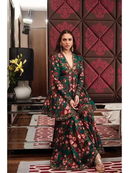 Another view of the floral peplum set, showing how it looks when seated. It's an outfit that is beautiful from every angle.
