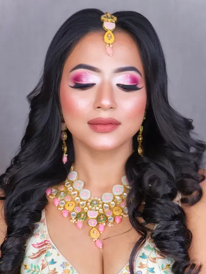 A gorgeous party look with vibrant pink eyeshadow and a soft, matte lip, perfect for making a statement.