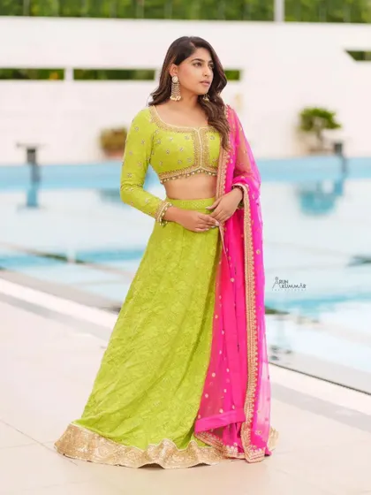 Actress Nishvika Naidu wears our vibrant lime green and pink lehenga for the 'Dance Karnataka Dance' show. This colorful and festive outfit is available for you to rent.