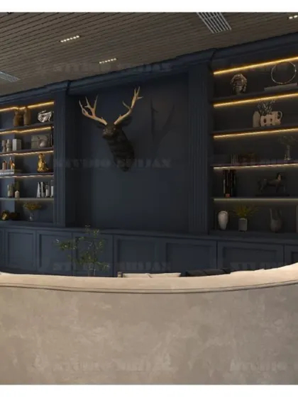 A bold lobby in Mansarovar Garden, featuring a dark blue library wall with a stag head sculpture, creating a moody and sophisticated "cigar lounge" feel.