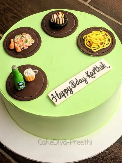 A simple cream cake for a foodie, topped with miniature edible versions of their favorite things: biryani, noodles, beer, and ice cream.