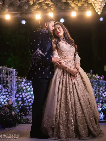 A romantic portrait of the couple under the lights. Mahima's makeup is soft and glowing, creating a beautiful and timeless image.