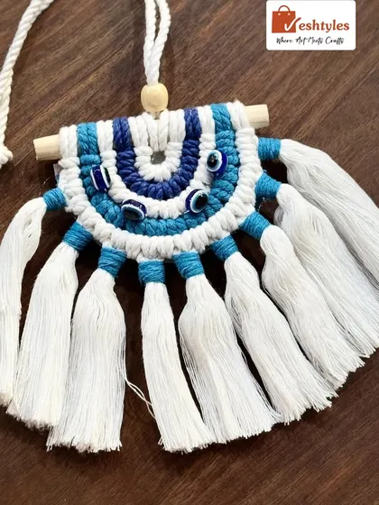 The finished evil eye car hanging, ready to be shipped to its new home.