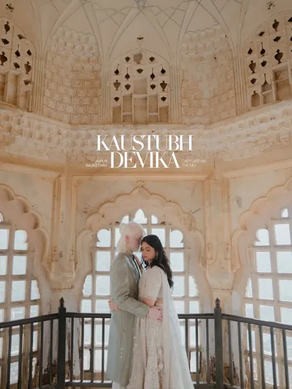 An intimate embrace within the intricate latticework of a Jaipur palace. The soft light filters through the jharokha, creating a serene and romantic portrait that feels both timeless and personal.